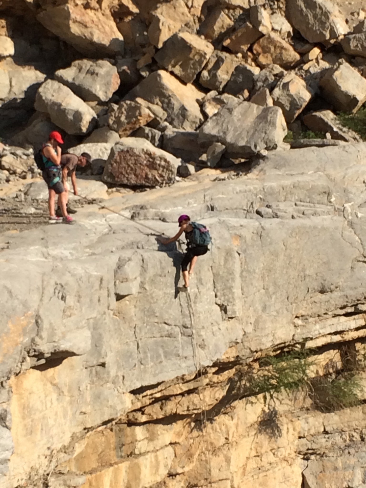 Julie McEnery climbing on a cliffside