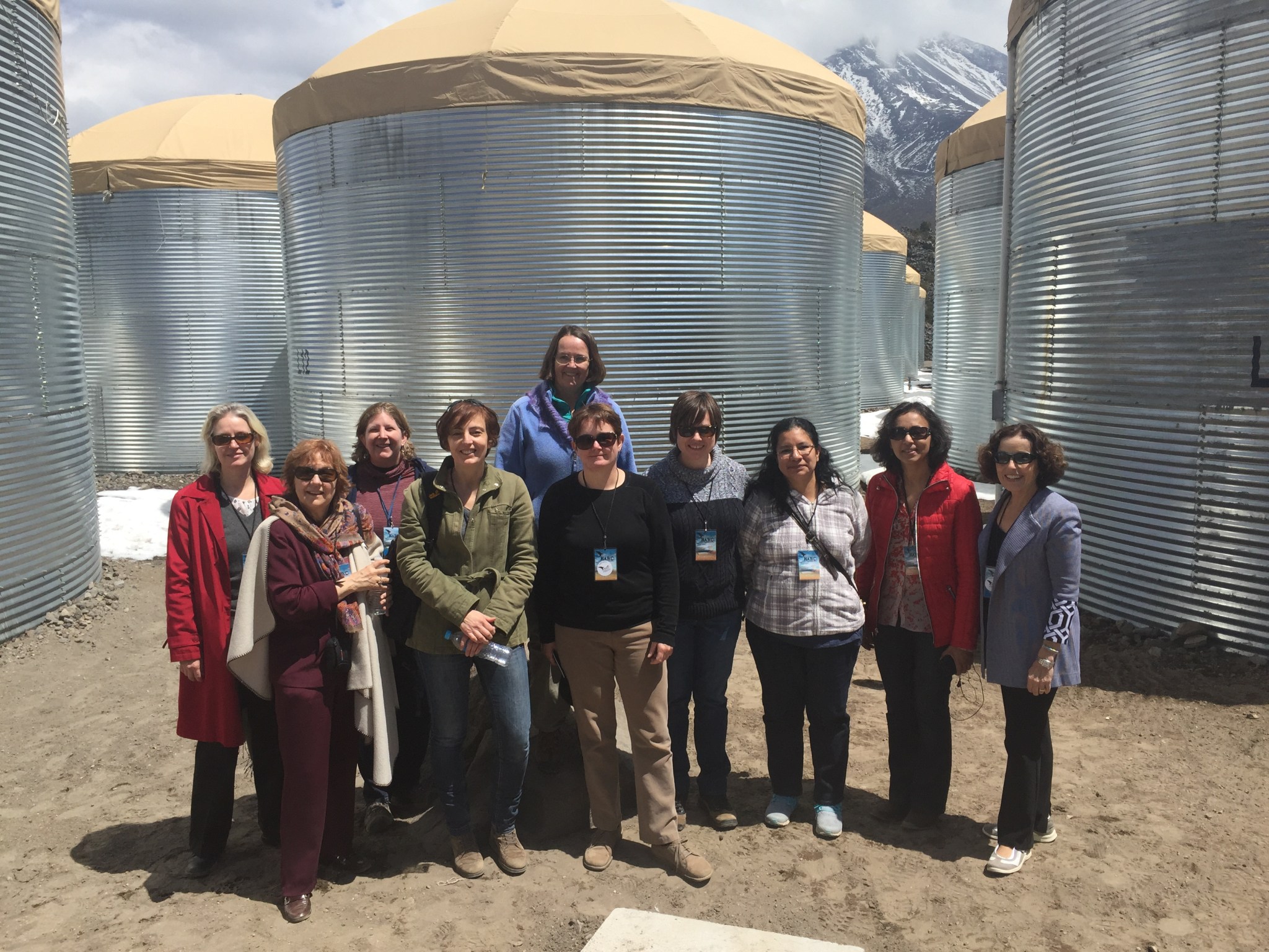 A group of ten women smile for the camera