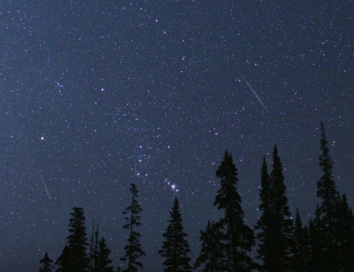 The constellation Orion is framed by two Perseid meteors on Aug. 12, 2018, in Cedar Breaks National Monument, Utah.