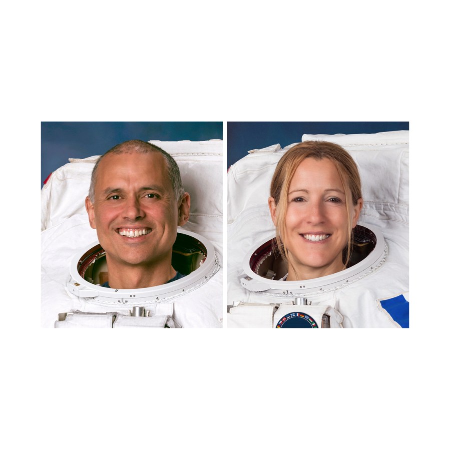 Astronauts Anil Menon of NASA and Sophie Adenot of ESA pose for their official portraits while wearing spacesuits at the Johnson Space Center in Houston, Texas.