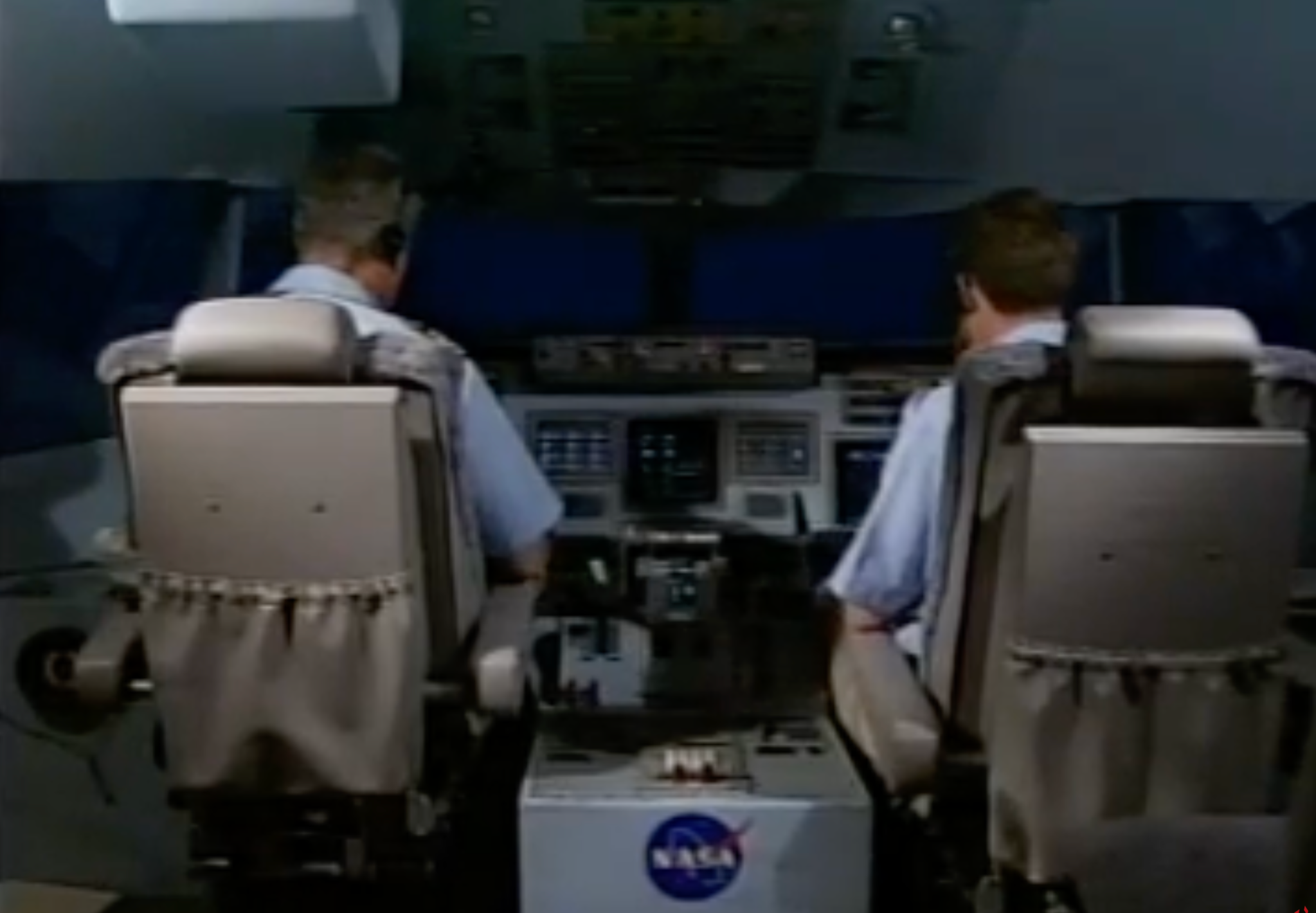 Two pilots participating in a Distributed Air Ground Traffic Management (DAG-TM) study in a flight simulator at NASA Ames Research Center