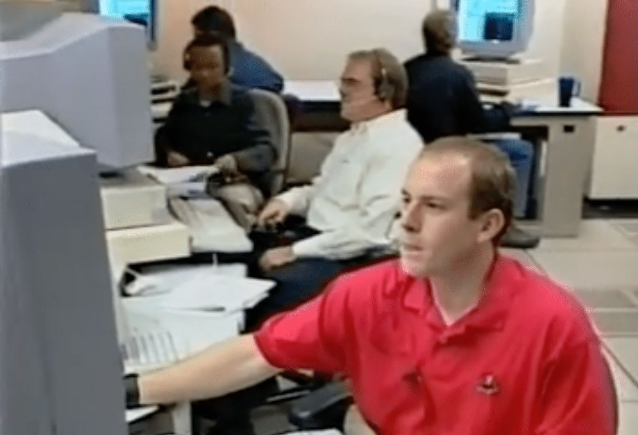 Air traffic controllers participating in a Distributed Air-Ground Traffic Management (DAG-TM) simulation in the Airspace Operations Laboratory (AOL) at NASA Ames Research Center.