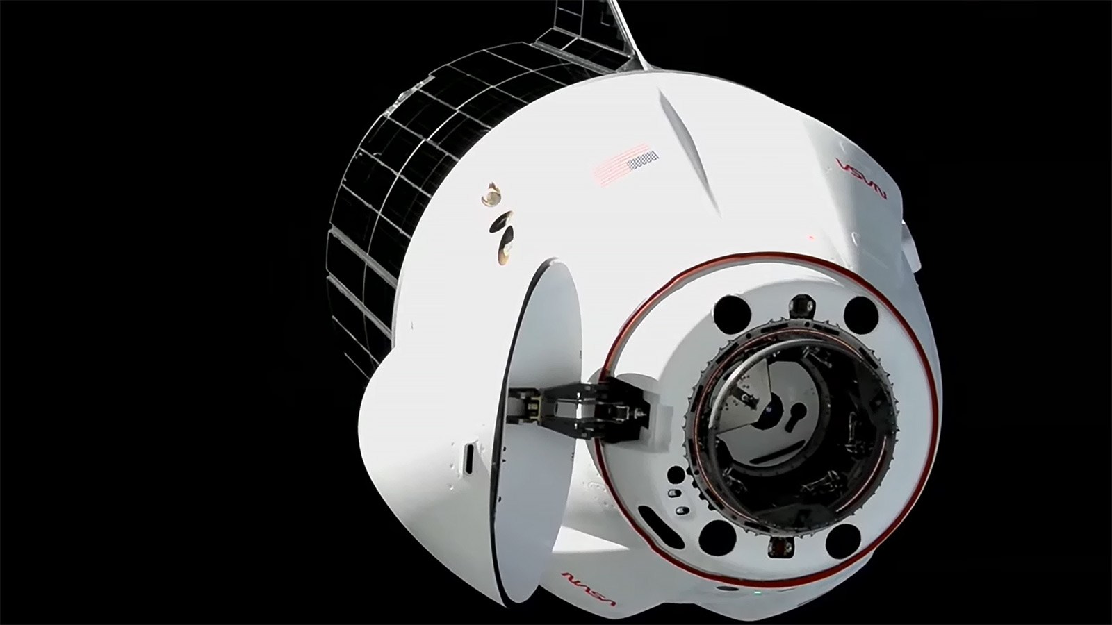 SpaceX Dragon Docks with Science, Supplies, and Roll-Out Solar Arrays