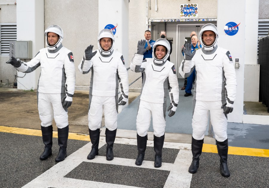 NASA’s SpaceX Crew-13 crew members wave to family and friends as they prepare to depart the Neil A. Armstrong Operations and Checkout Building at the agency’s Kennedy Space Center in Florida for nearby Space Launch Complex 40 at Cape Canaveral Space Force Station for launch of Crew-13 on Thursday, Oct. 1, 2026.