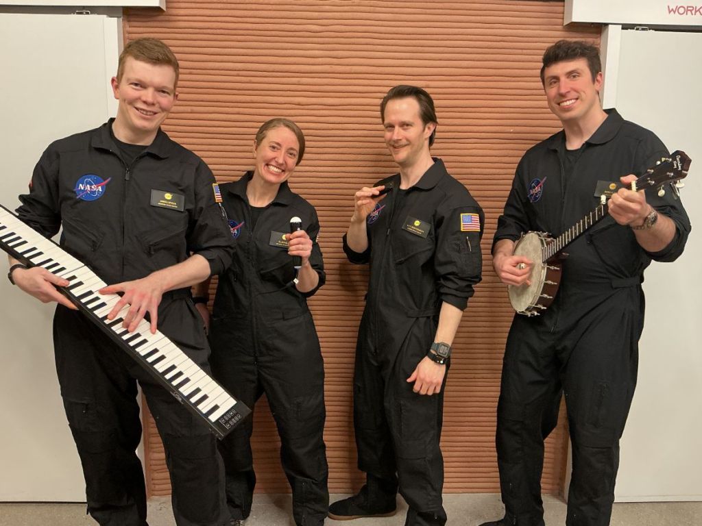 The CHAPEA crew showcases the instruments they brought on their mission. The crew elected to include instruments as part of their personal item allowance. From left: James Spicer, Ellen Ellis, Matthew Montgomery, and Ross Elder.