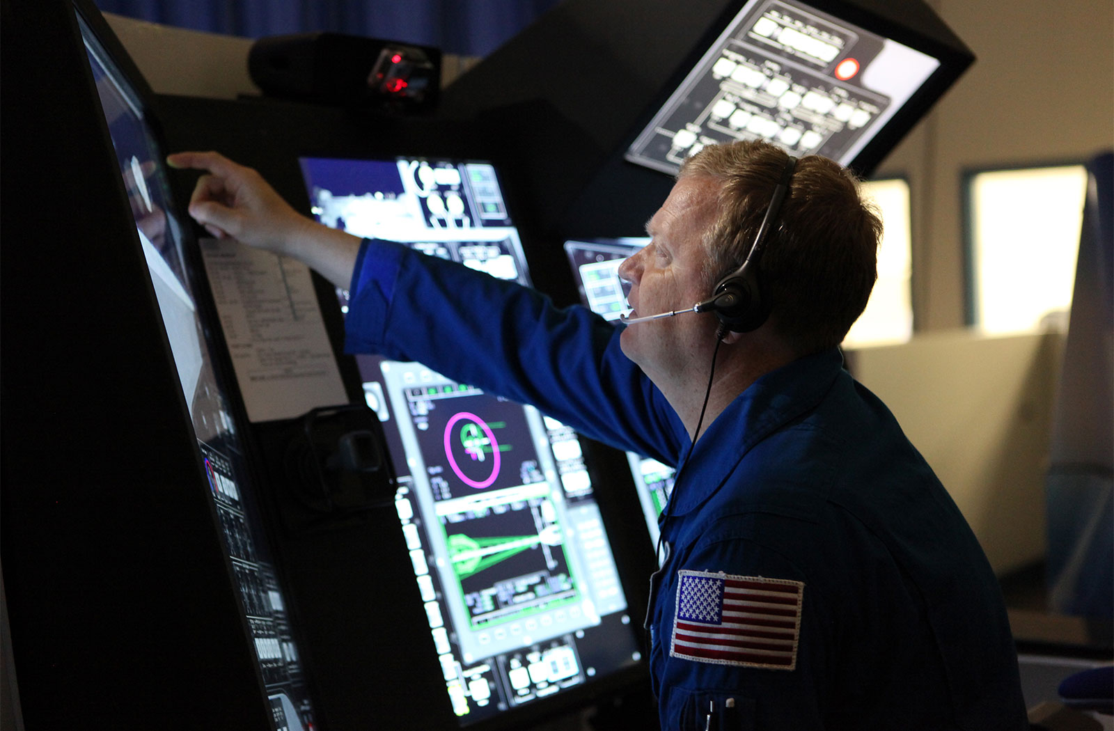 Commercial Crew astronaut Eric Boe practices docking operations for Boeing's CST-100.