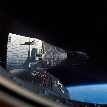 Photo of Gemini VII as seen from the hatch window of Gemini VI.