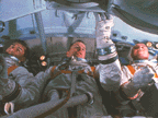 3 astronauts in spacesuits without helmuts in training