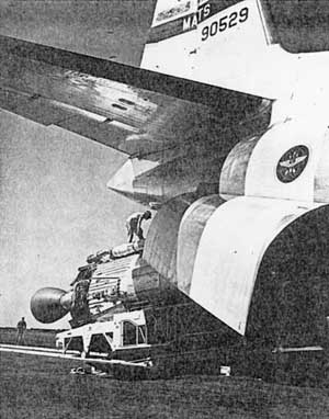 massive Atlas launch vehicle being offloaded from a large transport aircraft