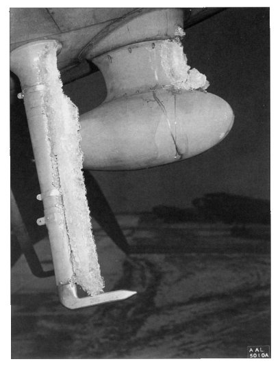 Ice jutting forward on the radio antenna and airspeed pitot mast of a C-46