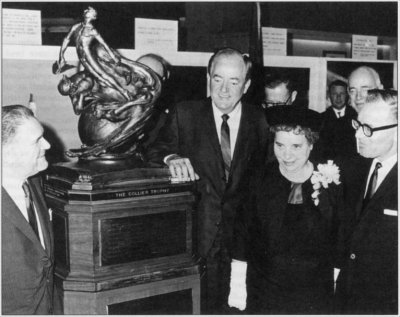 Photo of Webb and Dryden receiving the Collier Trophy from Vice President Humphrey.