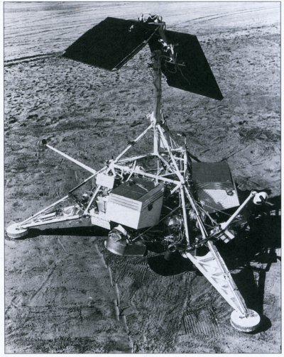Photo of a mock-up of the Surveyor on the desert sand.