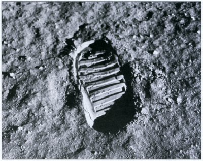 Photo of a single footprint in the lunar soil.