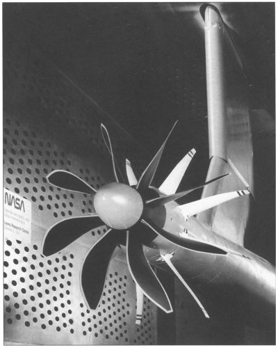 Photo of an advanced propeller on a test arm in the supersonic tunnel.