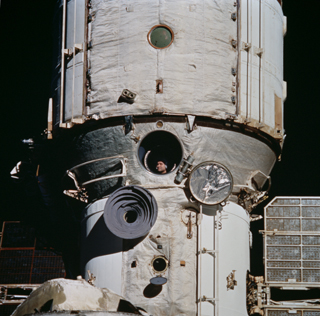 Cosmonaut Valeri Polyakov looks out Mir's window during rendezvous operations with Discovery and the STS-63 mission