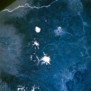 Mt. Rainier, Mt. St. Helens, Mt. Adams, Columbia River, Seattle, checkerboard pattern forestry cutting Washington state, USA.