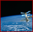 View of the Mir space station rising above the Earth limb during flyaround