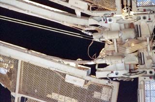 The damaged Spektr solar array, viewed from a window on the Mir Space Station during NASA-6. 