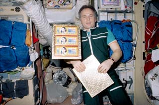 Solovyev holding a presentation item bearing his picture.