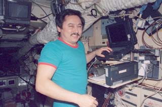 Mir-25 commander Talgat Musabayev with laptop computer