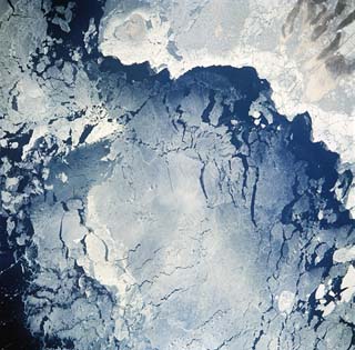 Coastal ice flows, Caspian Sea near the Volga River mouth delta.