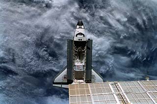 Above shot of the orbiter, with payload bay open, showing entire shuttle. 