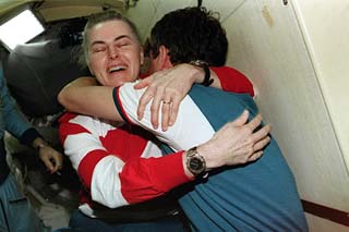 Astronaut Shannon Lucid bids farewell to Korzun prior to returning with the STS-79 crew for undocking procedures.