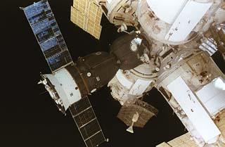 View of the Soyuz spacecraft docked to the Mir space station center docking node. 