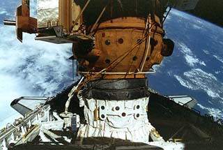 View of the docked configuration of the Docking Module (DM), Androgynous Peripheral Assembly System (APAS) and Orbiter Docking System (ODS). 