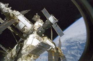 Survey view taken of the Mir space station by the crew of the STS-86 orbiter Atlantis includes Kvant II, Priroda, Spektr, Kristall and Soyuz spacecraft 