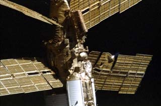 Survey views of the Mir space station taken by the crew of the STS-86 orbiter Atlantis including Spektr module with the damaged radiator and solar array SP#1 visible.
