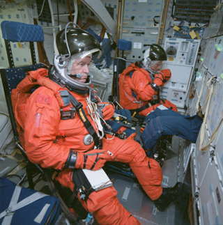STS-91 crewmembers perform a fitcheck in their Launch and Entry Suits