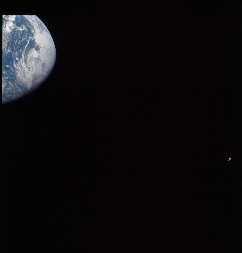 AS08-16-2594 - Earth and S-IVB, both cropped at the edge of frame