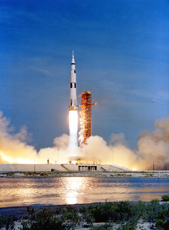 The Apollo 11 space vehicle rises from the launch pad