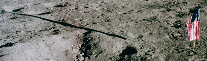 View of the flag and shadow from LMP's window after
          EVA-1