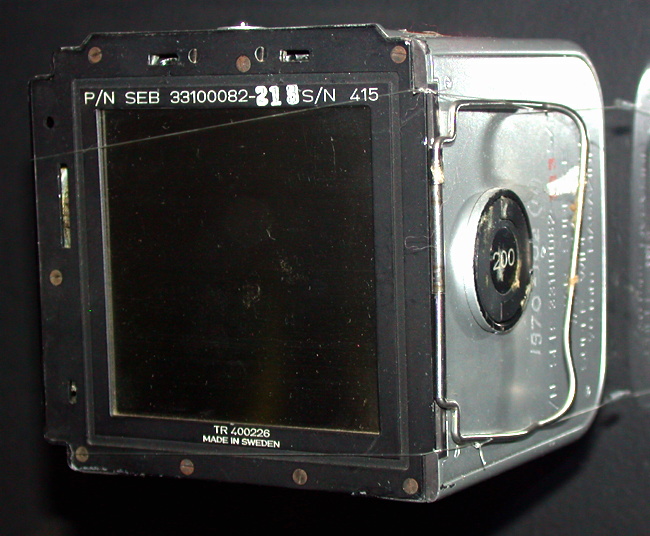 Front and lefthand
          surfaces of the Apollo 11 Hasselblad magazine showing the
          large wire dark-slide handle designed for use with gloves