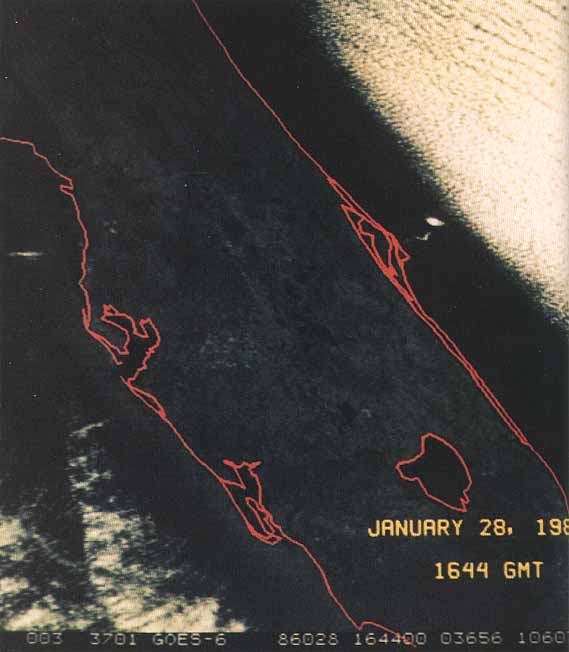 At 11:44 a.m. Eastern Standard Time, a GOES environment-monitoring satellite operated by the National Oceanic and Atmospheric Administration acquired this image of the smoke and vapor cloud from the 51-L accident. The coast of Florida is outlined in red.