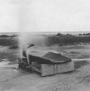 Photograph 3. Setup for Burning Residual Propellant from Recovered Pieces of SRM.