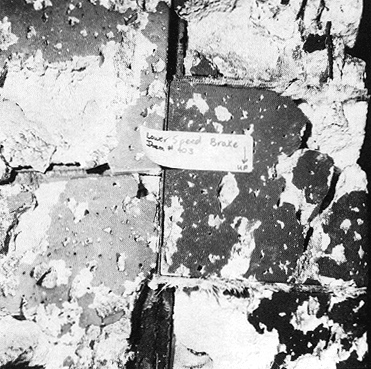 Photograph 7. Closeup View of Damaged Tiles of Right Rudder Speed Brake.