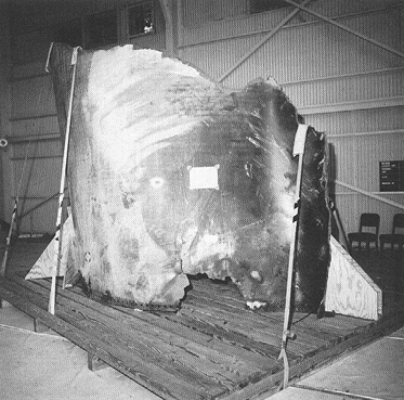 Photograph 2. Exterior View of Piece of Right SRM, SSC No. 131. Note Burned-Out Area at Base.
