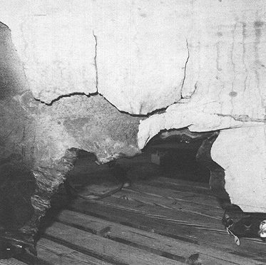 Photograph 5. Interior View of SSC No. 131 Piece. Note Tapered Edges of Casing Indicating Burn-Through from the Inside to the Outside.