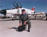 Photo of Chuck Yeager and a F-4 fighter jet